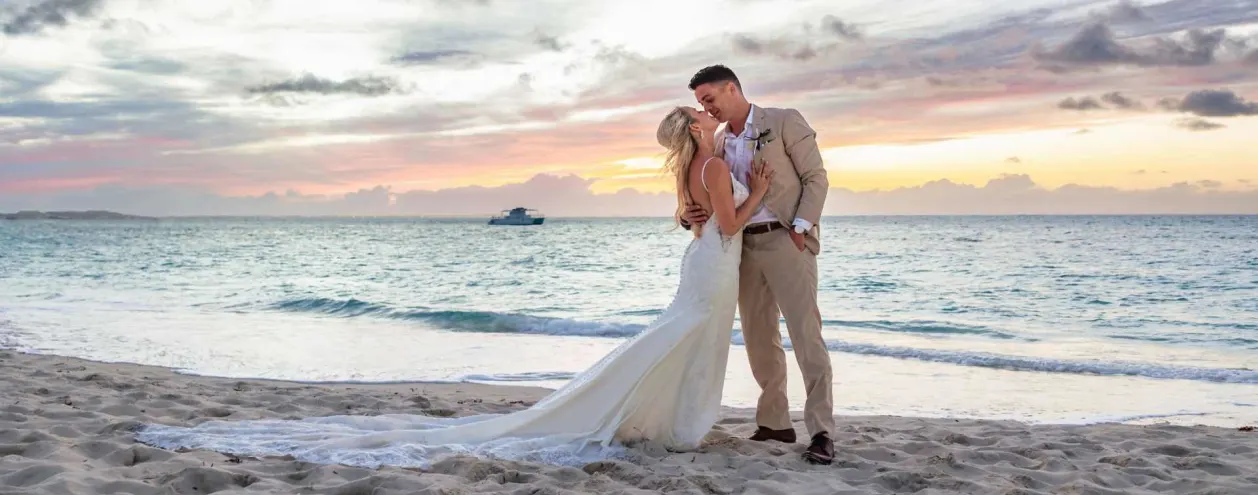 Beaches Turks & Caicos wedding couple kissing on beach